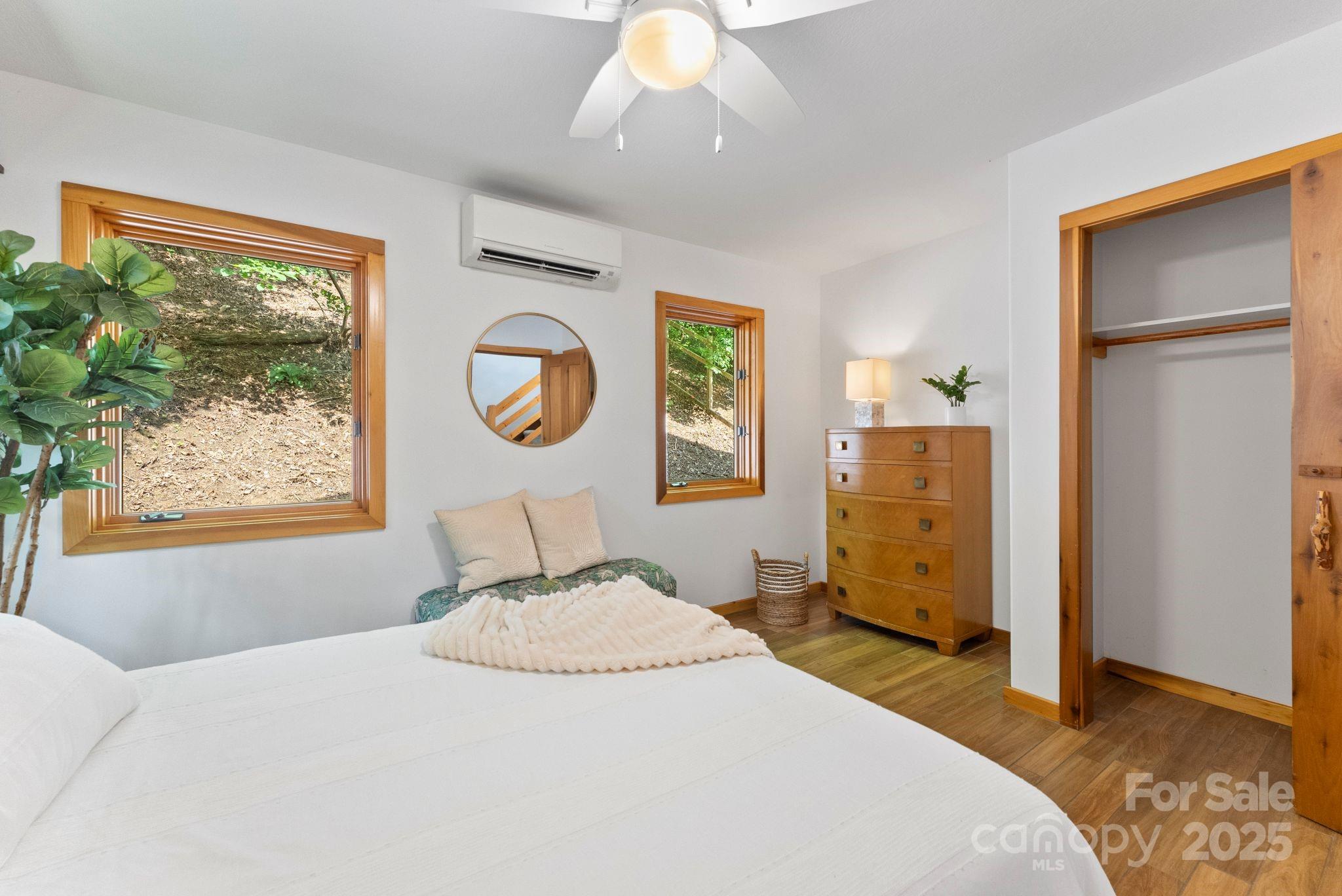 48 Black Oak Forest Road Fairview, NC 28730 - Photo 34 of 48 a bedroom with a bed and a window