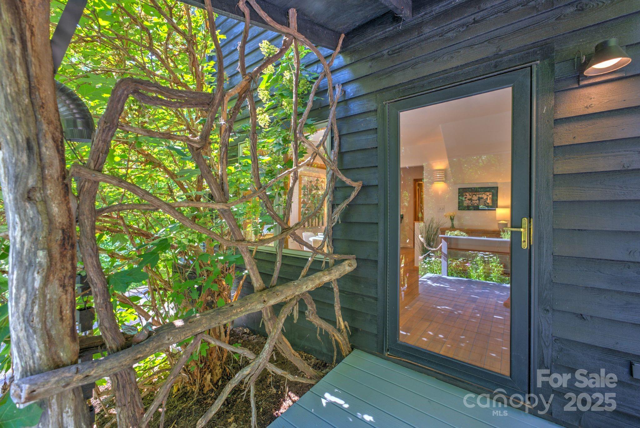 48 Black Oak Forest Road Fairview, NC 28730 - Photo 9 of 48 a view of an entryway with a tree
