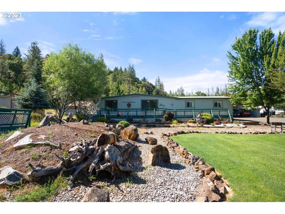 890 Crowfoot Road Eagle Point, OR 97524 - Photo 3 of 48 a view of a backyard with furniture and a fire pit