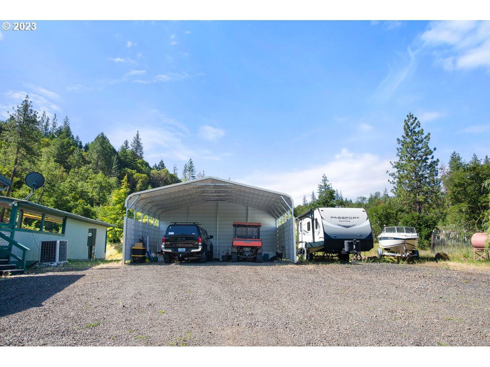 890 Crowfoot Road Eagle Point, OR 97524 - Photo 6 of 48 a view of house with outdoor space and car parked