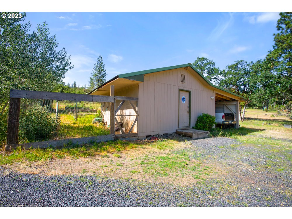 890 Crowfoot Road Eagle Point, OR 97524 - Photo 7 of 48 a view of an house with backyard space and garden
