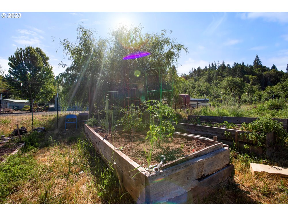 890 Crowfoot Road Eagle Point, OR 97524 - Photo 9 of 48 a view of a backyard with sitting area
