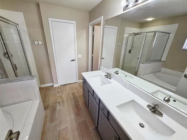 a bathroom with a sink and mirror