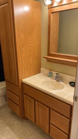 a bathroom with a sink and a mirror
