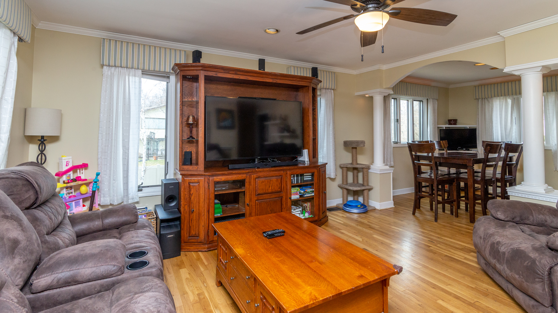 400 Frederick Lane Hoffman Estates, IL 60169 - Photo 5 of 34 a living room with furniture and a flat screen tv