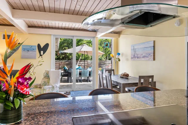 a living room with furniture a fireplace and a table