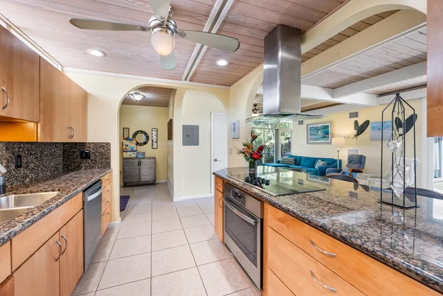 a kitchen with a table and chairs