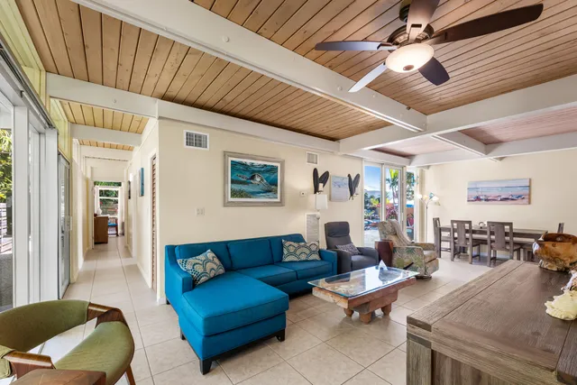 a living room with furniture rug and wooden floor