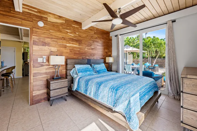 a view of a backyard with plants and a patio