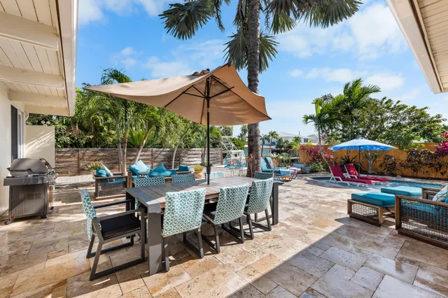 a view of a backyard with a sitting area and furniture