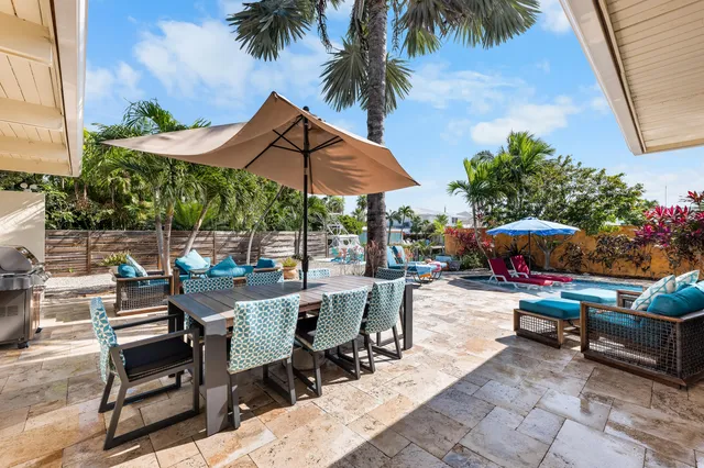 a view of a house with outdoor space and sitting area