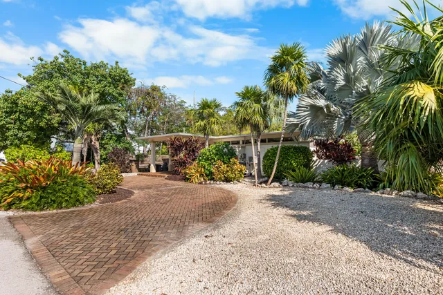 an aerial view of residential building and lake