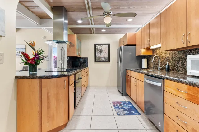 a living room with furniture and flowers