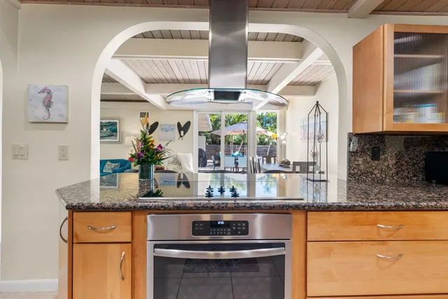 a kitchen with stainless steel appliances granite countertop a sink and cabinets