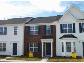 3236 Barons Court Road, Unit 9 Charlotte, NC 28213 - Photo 1 of 1 a front view of a house with a yard