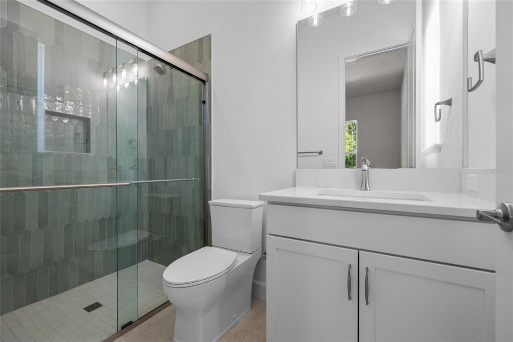 13425 Southwest 9th Road Newberry, FL 32669 - Photo 16 of 37 a bathroom with a sink toilet and shower