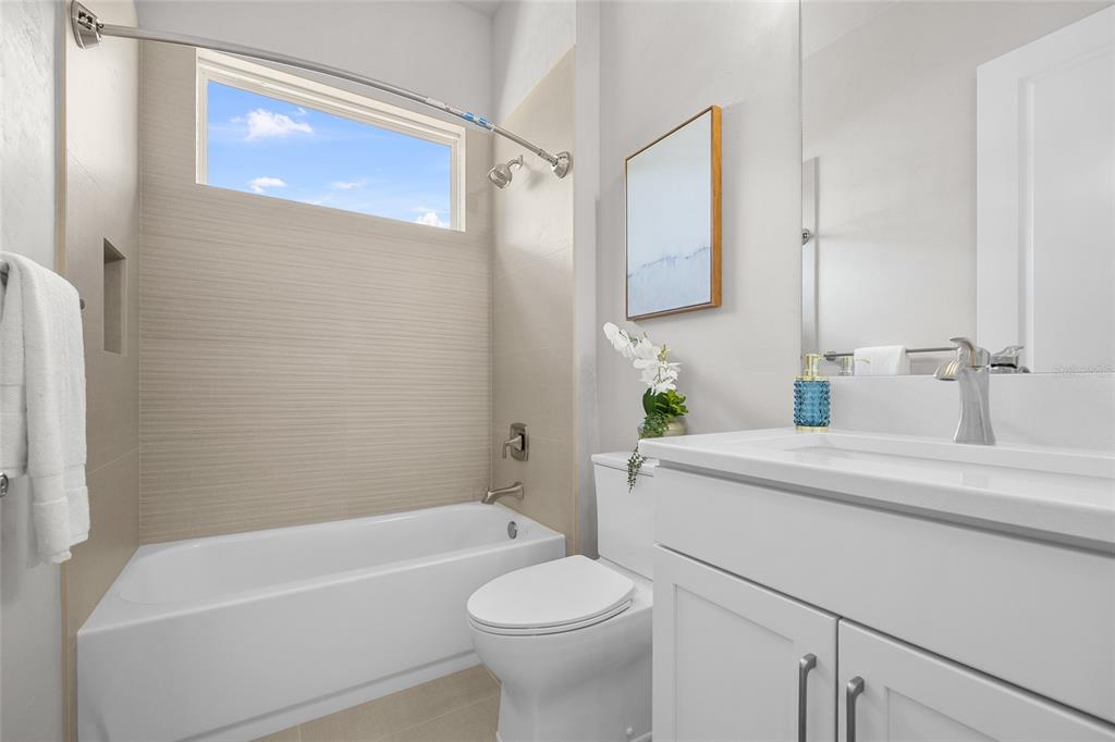 13425 Southwest 9th Road Newberry, FL 32669 - Photo 19 of 37 a bathroom with a sink a toilet and shower