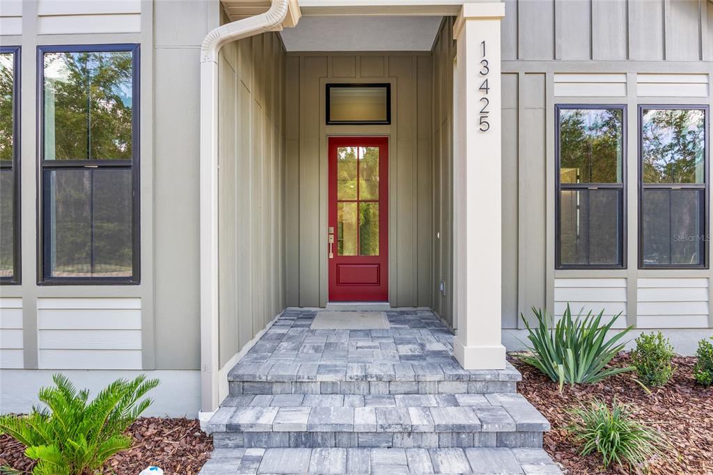 13425 Southwest 9th Road Newberry, FL 32669 - Photo 2 of 37 a front view of a house with a yard