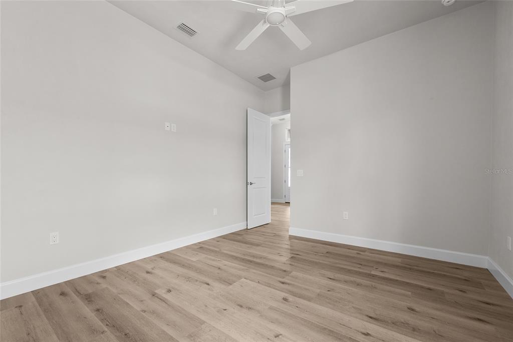 13425 Southwest 9th Road Newberry, FL 32669 - Photo 21 of 37 wooden floor in a empty room