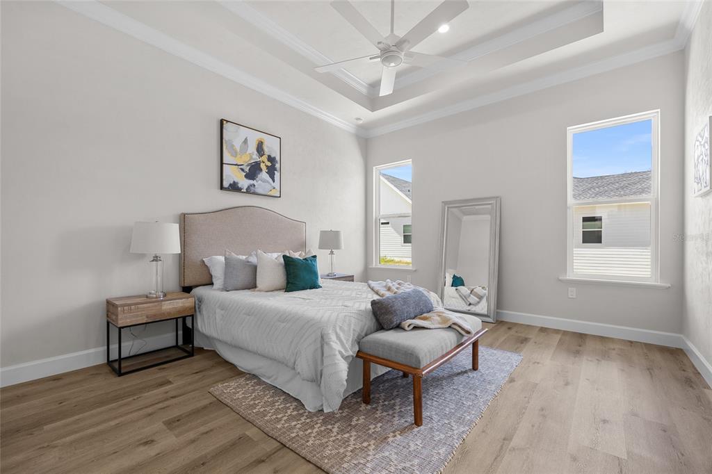 13425 Southwest 9th Road Newberry, FL 32669 - Photo 22 of 37 a spacious bedroom with a bed and a window