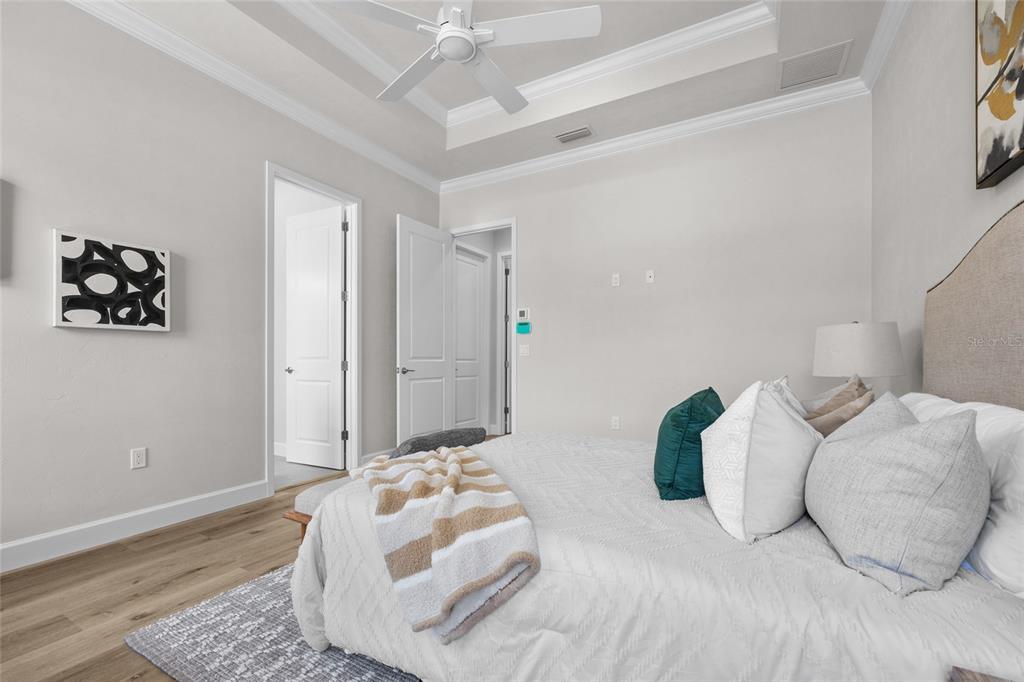 13425 Southwest 9th Road Newberry, FL 32669 - Photo 23 of 37 a bedroom with bed and a couch