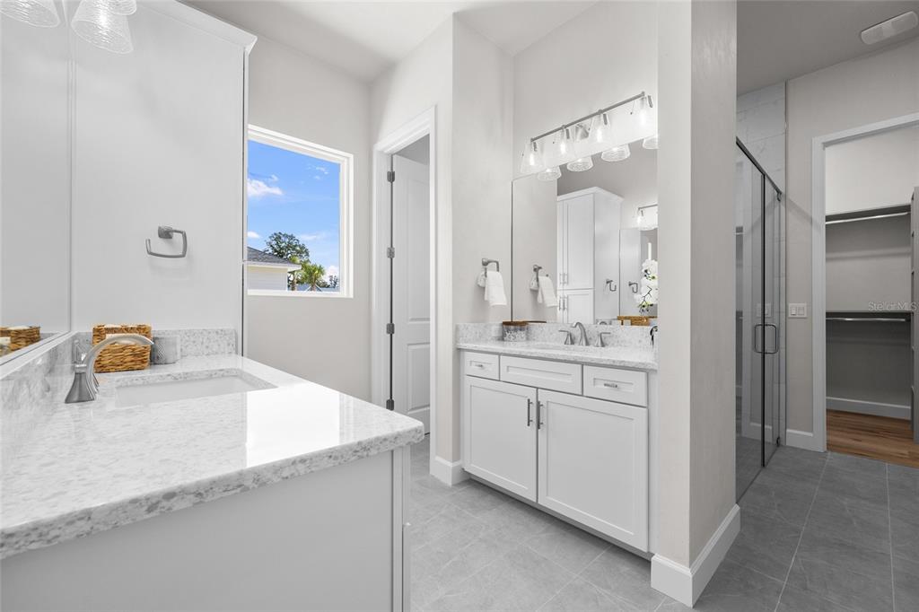 13425 Southwest 9th Road Newberry, FL 32669 - Photo 24 of 37 a bathroom with a granite countertop sink and a mirror