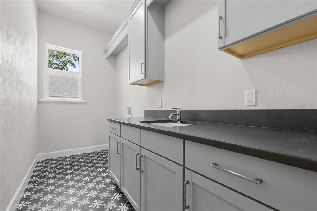 13425 Southwest 9th Road Newberry, FL 32669 - Photo 28 of 37 a kitchen with a sink and cabinets