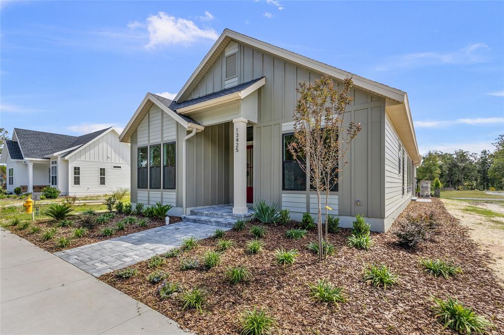 13425 Southwest 9th Road Newberry, FL 32669 - Photo 29 of 37 a front view of a house with garden