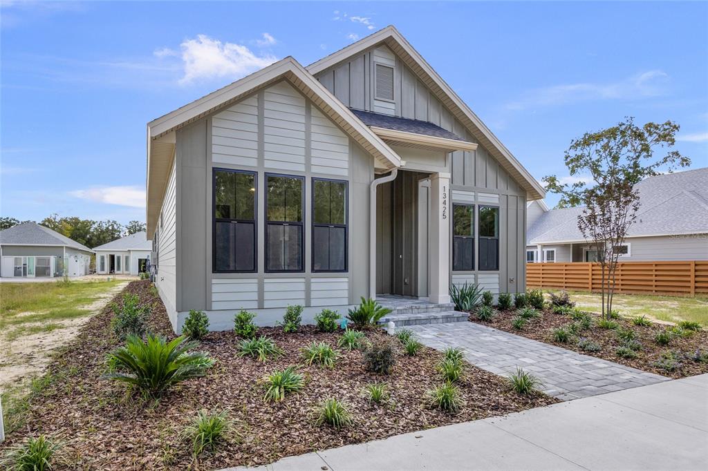 13425 Southwest 9th Road Newberry, FL 32669 - Photo 30 of 37 a front view of a house with garden