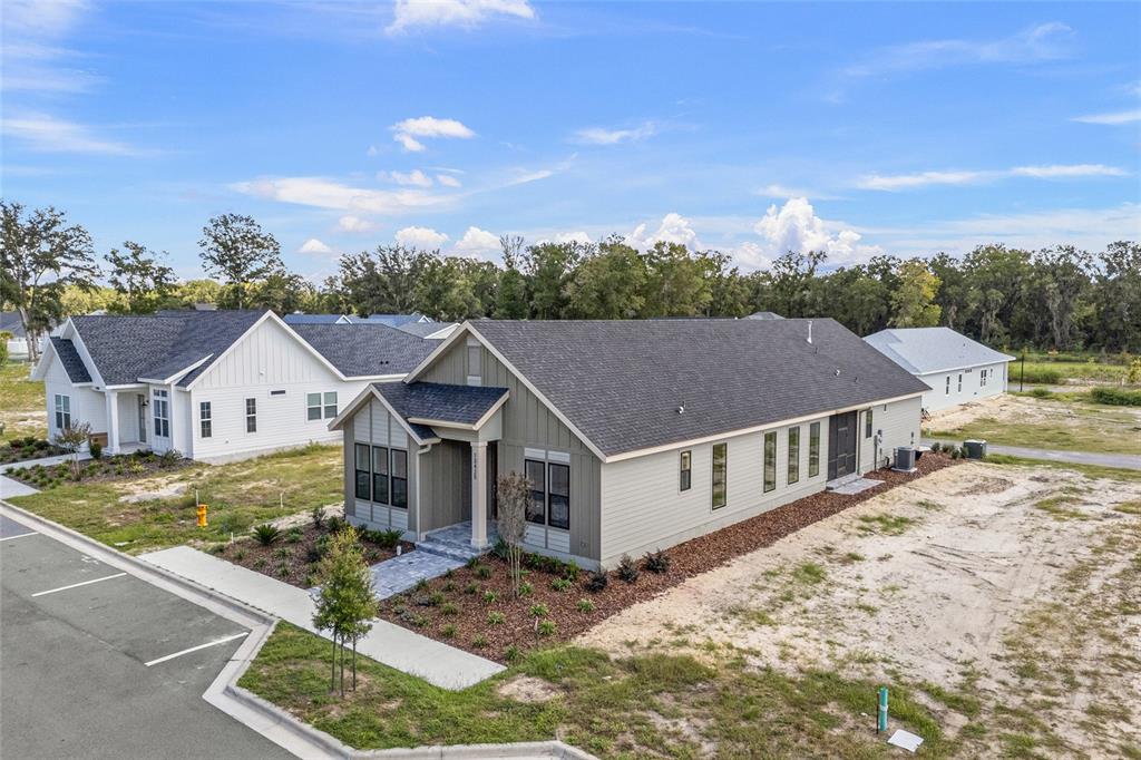 13425 Southwest 9th Road Newberry, FL 32669 - Photo 32 of 37 a aerial view of a house with a big yard and large tree
