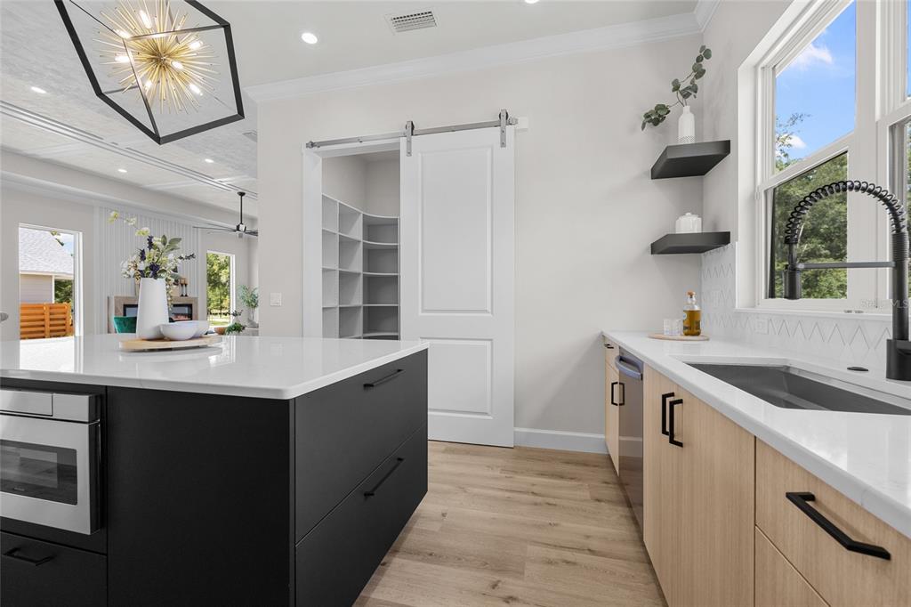 13425 Southwest 9th Road Newberry, FL 32669 - Photo 7 of 37 a kitchen with a sink and cabinets