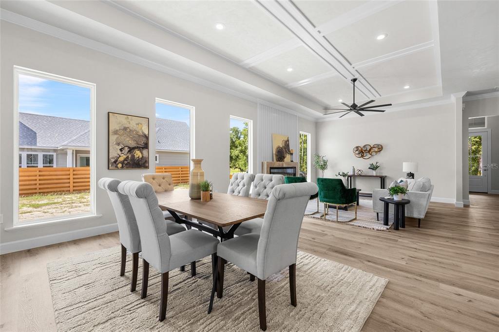 13425 Southwest 9th Road Newberry, FL 32669 - Photo 8 of 37 a view of a dining room with furniture and wooden floor