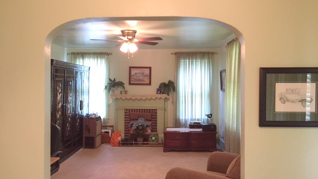 111 North Main Street Springfield, TN 37172 - Photo 11 of 25 a living room with furniture and a fireplace