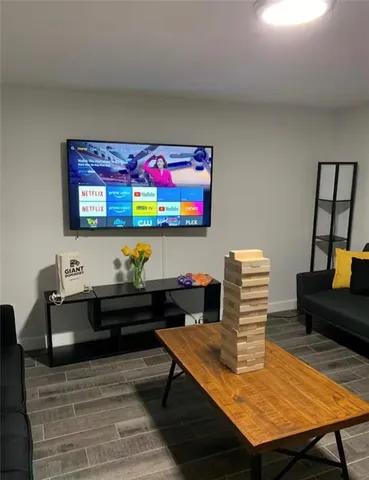 a large bedroom with a bed and a table in it