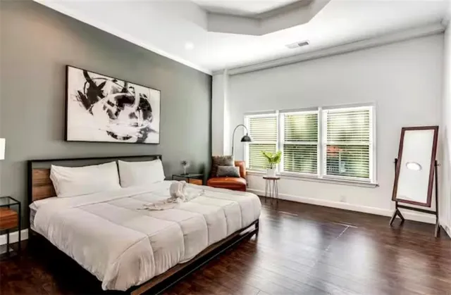 a large white bed in a white room