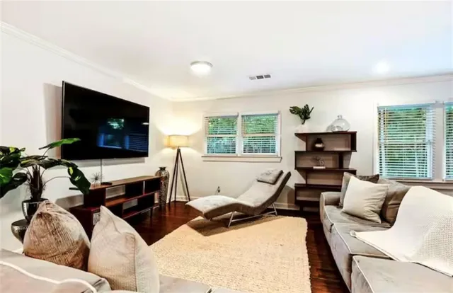 a spacious bedroom with a large bed and a couch