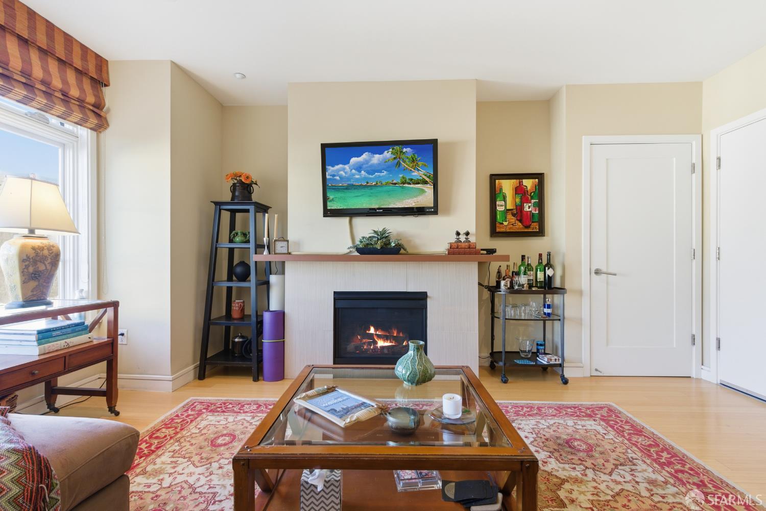 1725 Washington Street, Unit 9 San Francisco, CA 94109 - Photo 9 of 13 a living room with furniture and a fireplace
