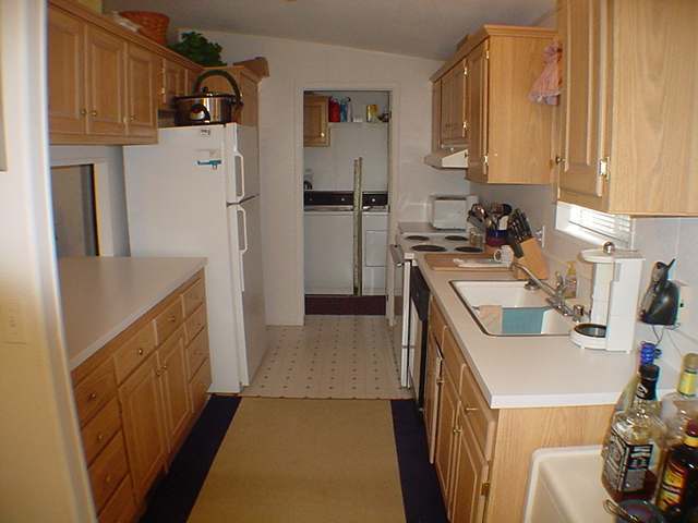 4315 East Blue Ridge Loop Pinetop, AZ 85935 - Photo 4 of 5 a kitchen with refrigerator and cabinets