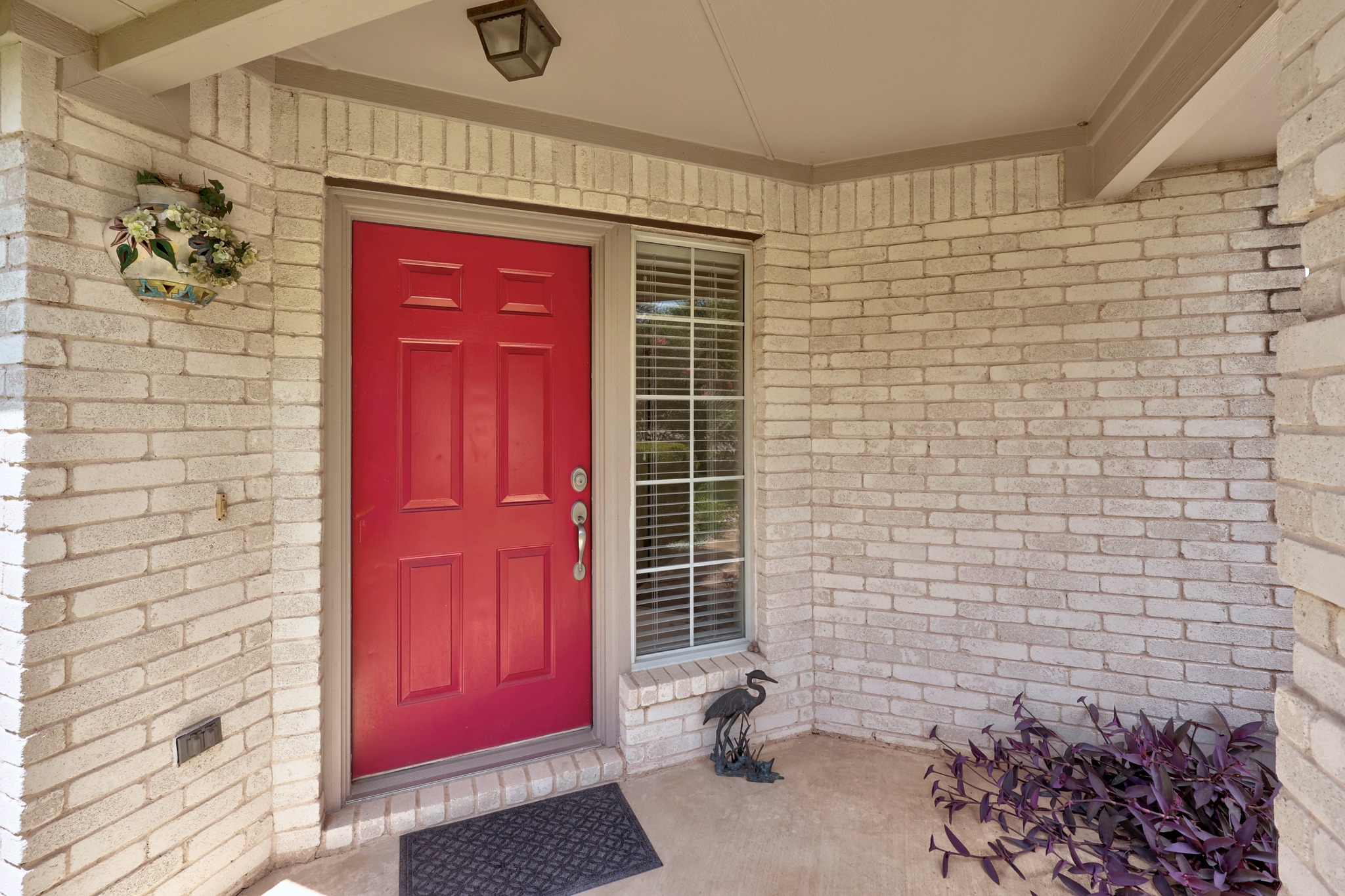 1108 Springbrook Road Pflugerville, TX 78660 - Photo 2 of 37 A vibrant front door welcomes you to this charming brick residence.