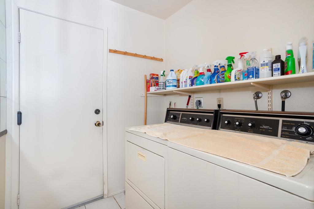 4427 Trieste Drive Carlsbad, CA 92010 - Photo 15 of 24 a utility room with dryer and washer