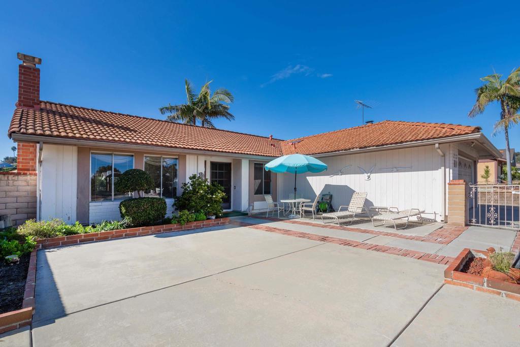 4427 Trieste Drive Carlsbad, CA 92010 - Photo 2 of 24 a view of a house with potted plants and floor to ceiling window
