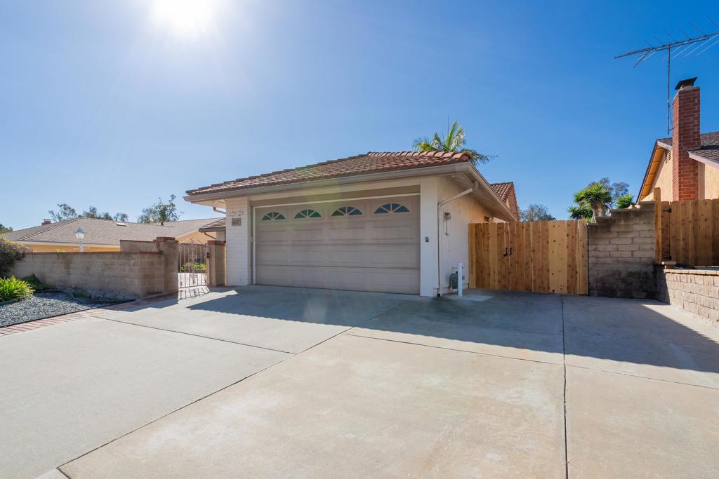 4427 Trieste Drive Carlsbad, CA 92010 - Photo 4 of 24 a front view of a house with a garage