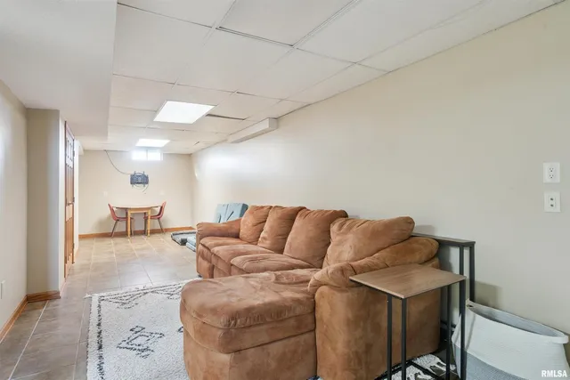 a view of a livingroom with furniture and windows