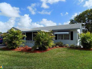 a view of a house with a garden