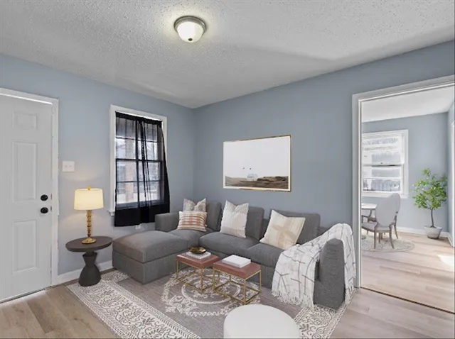 a living room with furniture and a window