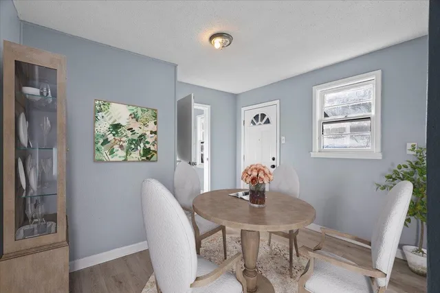 a dining room with furniture and window