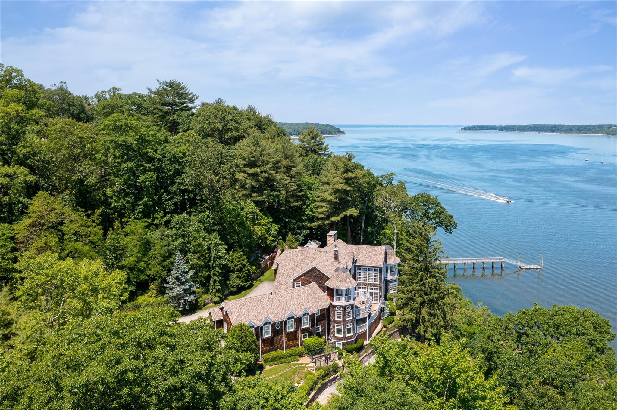 1386 Ridge Road Syosset, NY 11791 - Photo 11 of 11 an aerial view of a house with lots of trees