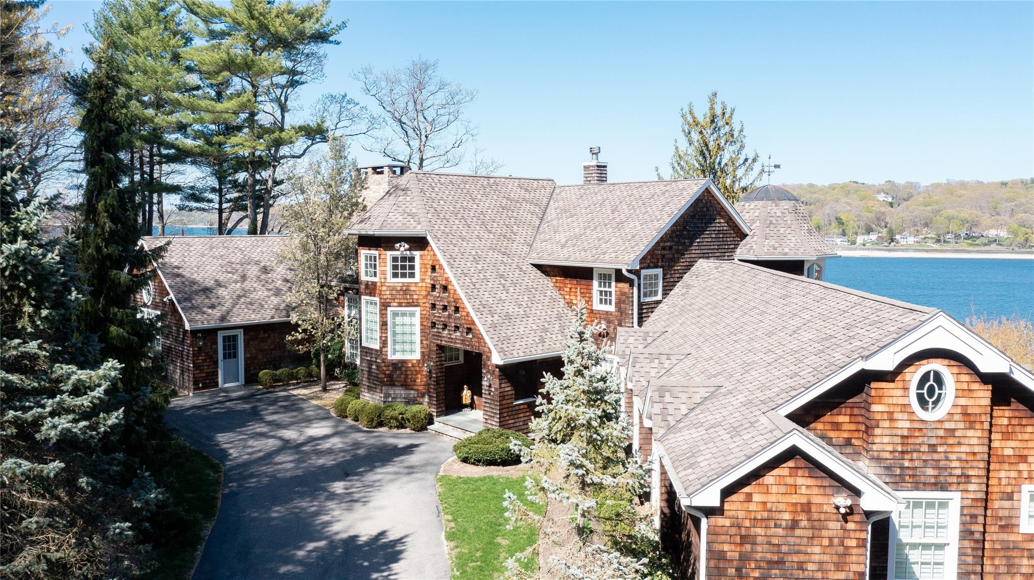 1386 Ridge Road Syosset, NY 11791 - Photo 7 of 11 a aerial view of a house with a yard and potted plants