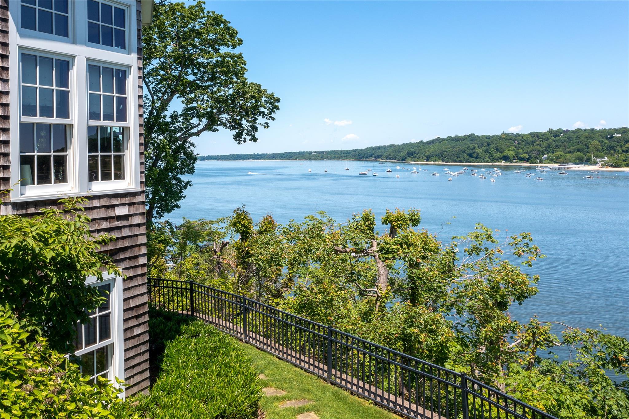 1386 Ridge Road Syosset, NY 11791 - Photo 9 of 11 a view of a lake with a house in the background