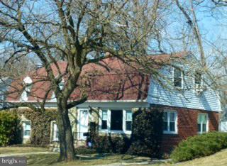 723 Nottingham Road Baltimore, MD 21229 - Photo 20 of 27 front view of a house with a tree